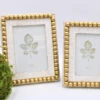 9.5" Wood Beaded Photo Frame, White With Gold 5x7" -Simply Devine Gifts And Decor Shop mn1 003655 1